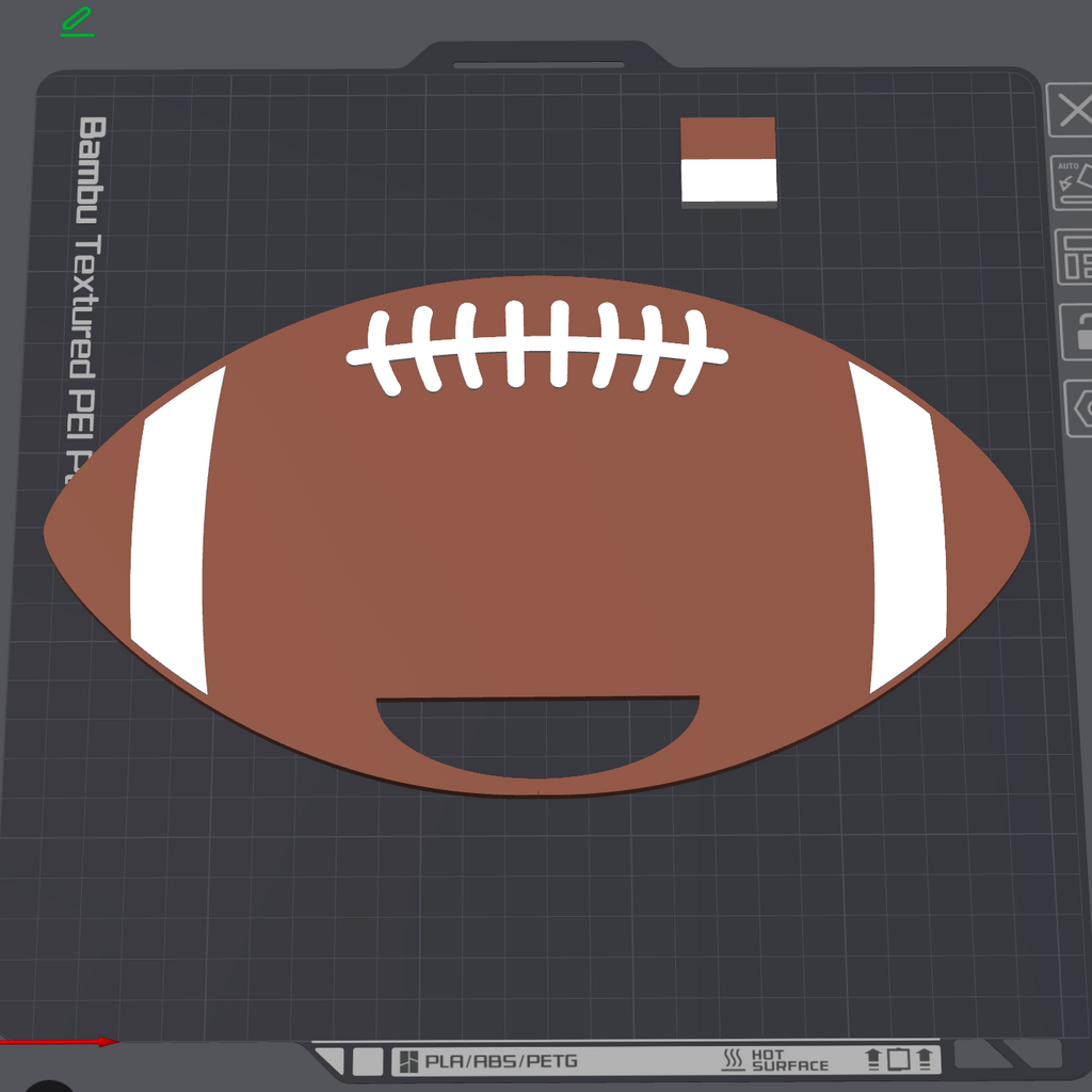 A 3D render of a football-shaped PETG print file preview on a dark gray grid workspace background, featuring a brown body with white laces and white side stripes.