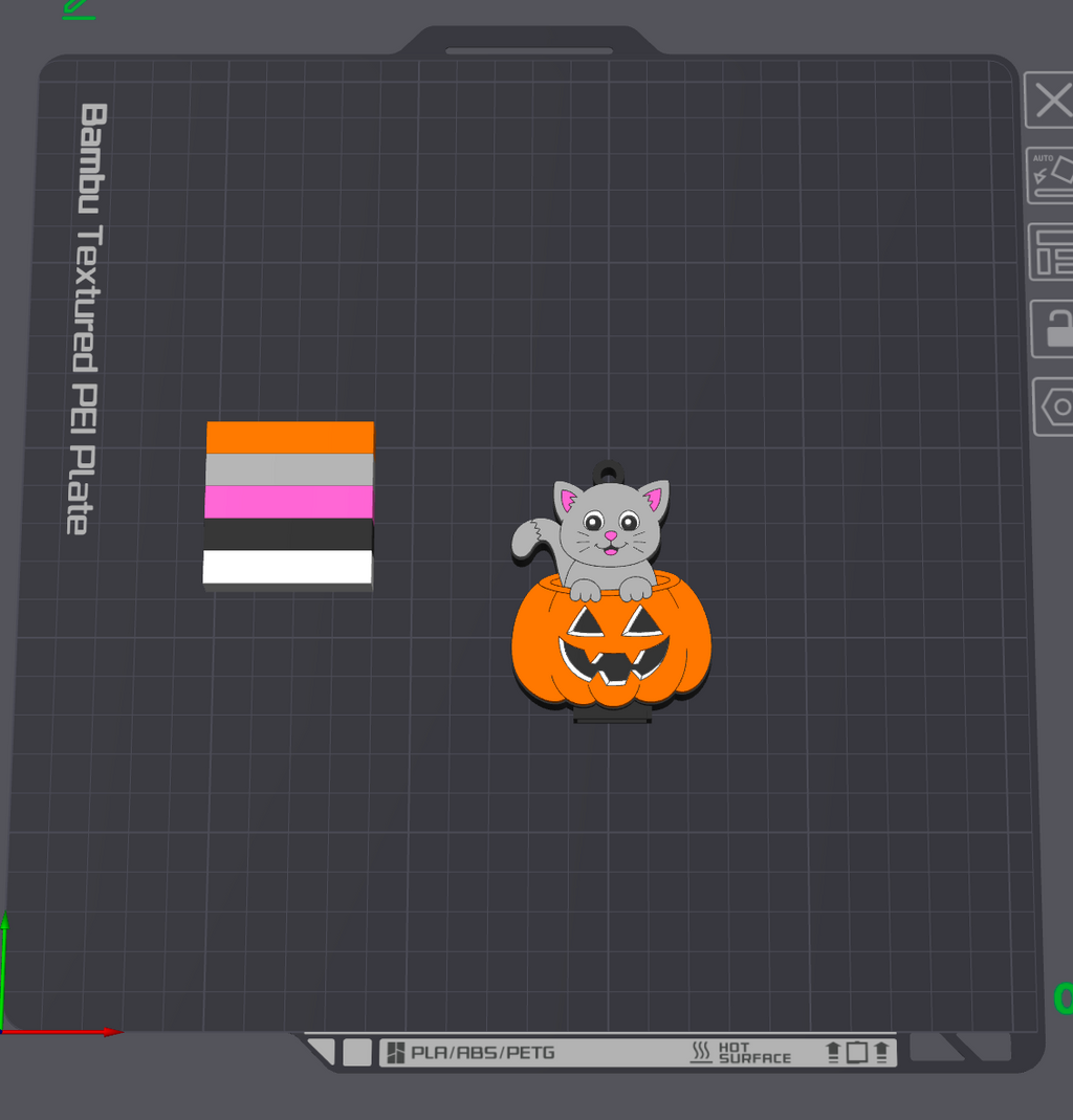 A digital preview of a custom pet nameplate or decal design on a dark gray grid interface. The design features a small gray cat sitting on an orange jack-o'-lantern pumpkin.
