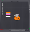 A digital preview of a custom pet nameplate or decal design on a dark gray grid interface. The design features a small gray cat sitting on an orange jack-o'-lantern pumpkin.