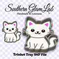 Digital product preview for a Southern Glam Lab handmade in Louisiana trinket tray 3D file featuring a cute white cartoon cat with pink ears. The image shows both the front view of the white cat and its 3D depth profile on a lavender and white checkered background with text reading 'Southern Glam Lab' and 'Trinket Tray 3MF File'.