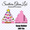 Digital preview graphic for a Southern Glam Lab soap holder file. The graphic features a pink Christmas tree with colorful ornaments and a star on top, alongside a pink 3D rendering of the tree-shaped soap holder, with text reading 'Southern Glam Lab', 'Handmade in Louisiana', 'Soap Holder 3MF File', and a checkered transparency-style background.